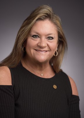 Gina Ensminger smiling in a black top