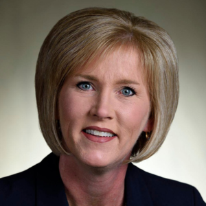 Lisa Earlywine smiling in a blue blazer