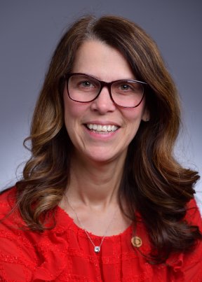 Cynthia Spieker smiling in a red blouse